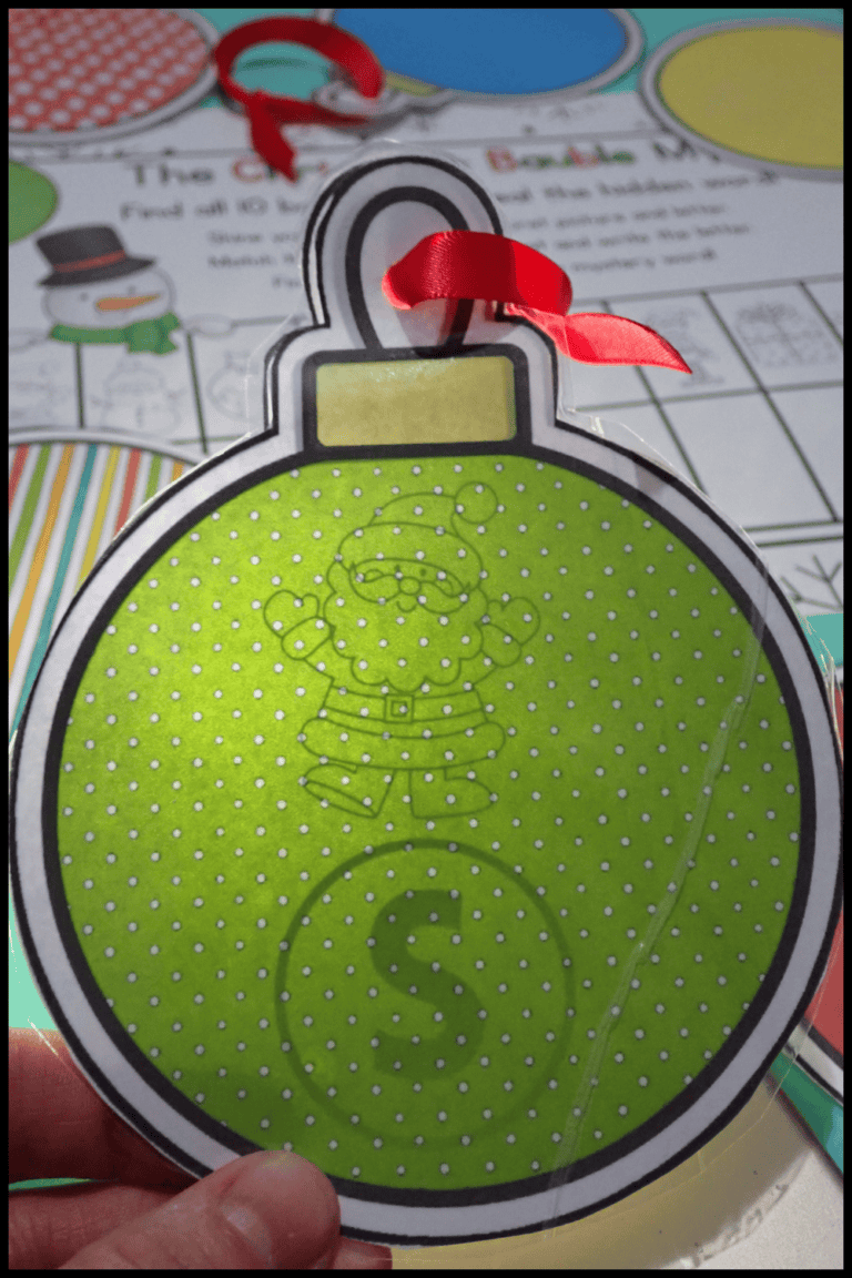 Christmas Bauble Mystery Scavenger Hunt where kids use a light to reveal a hidden clue