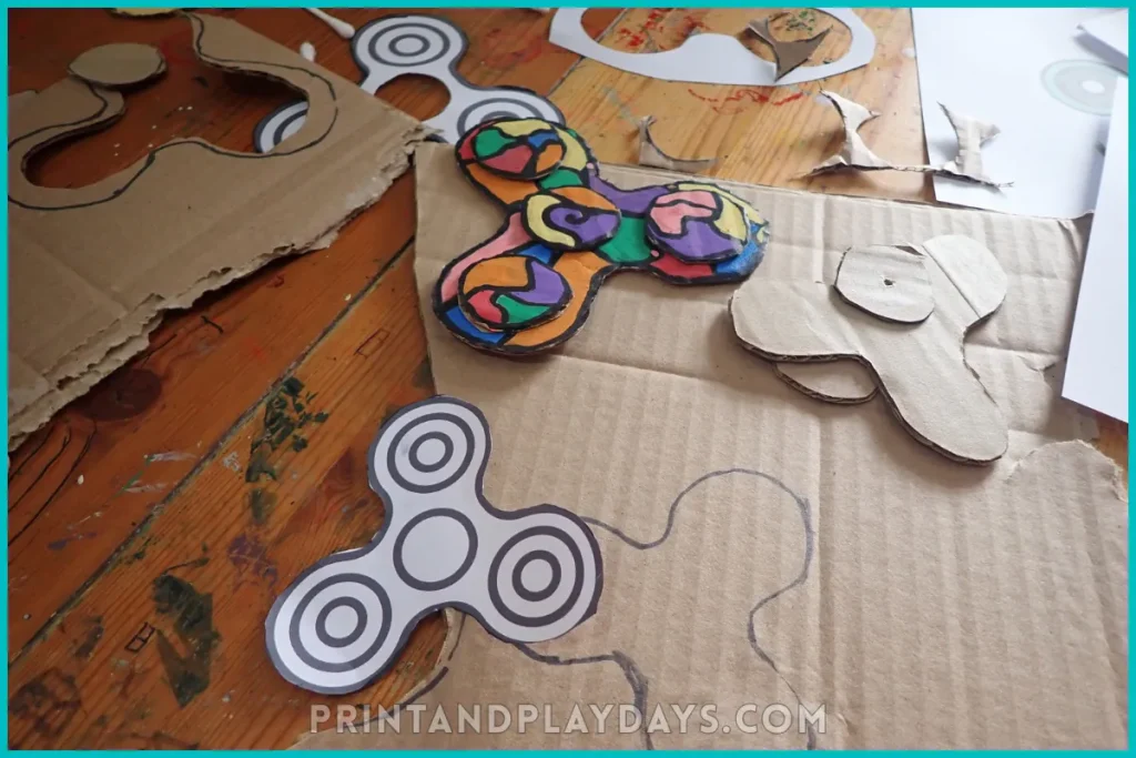 photograph of two fidget spinners being made out of cardboard